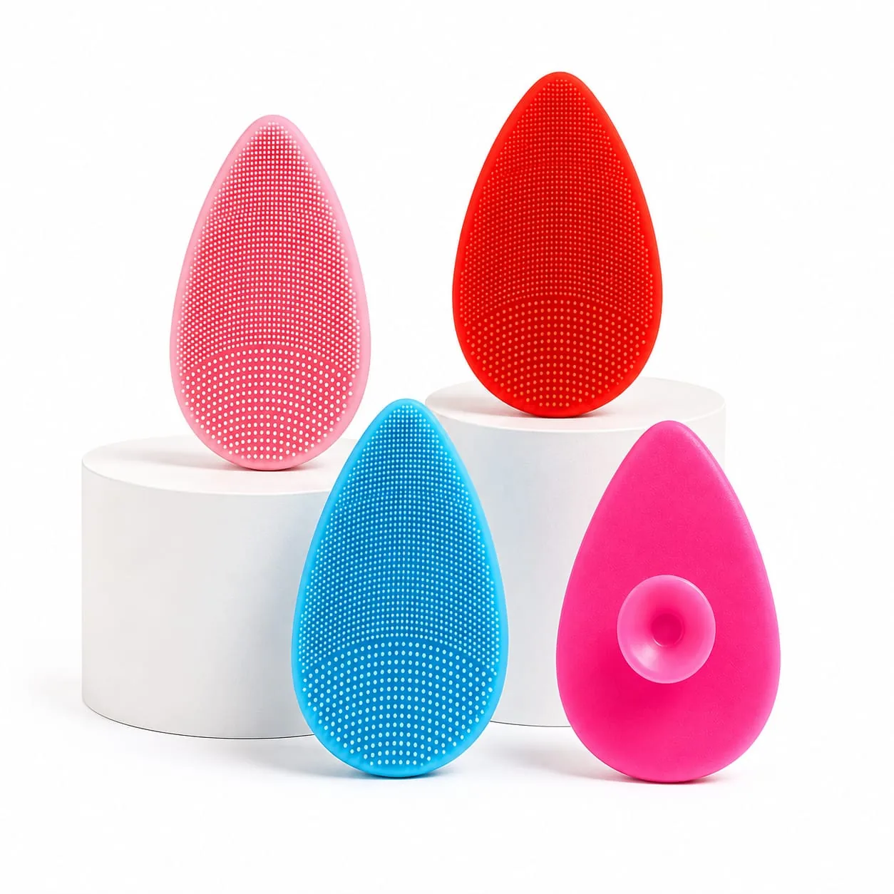 Four colorful ByShant silicone face scrubbers